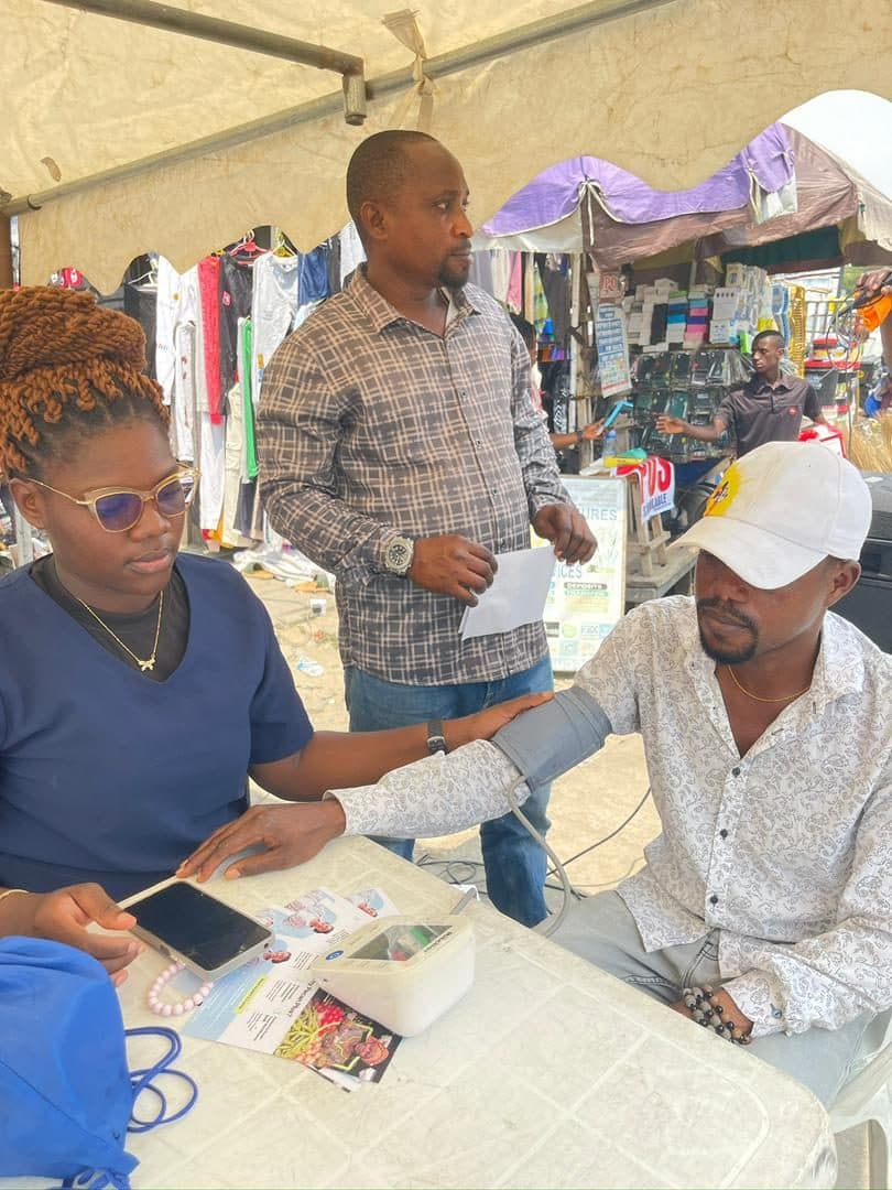 Free health check at a market stand under Pecan Plus